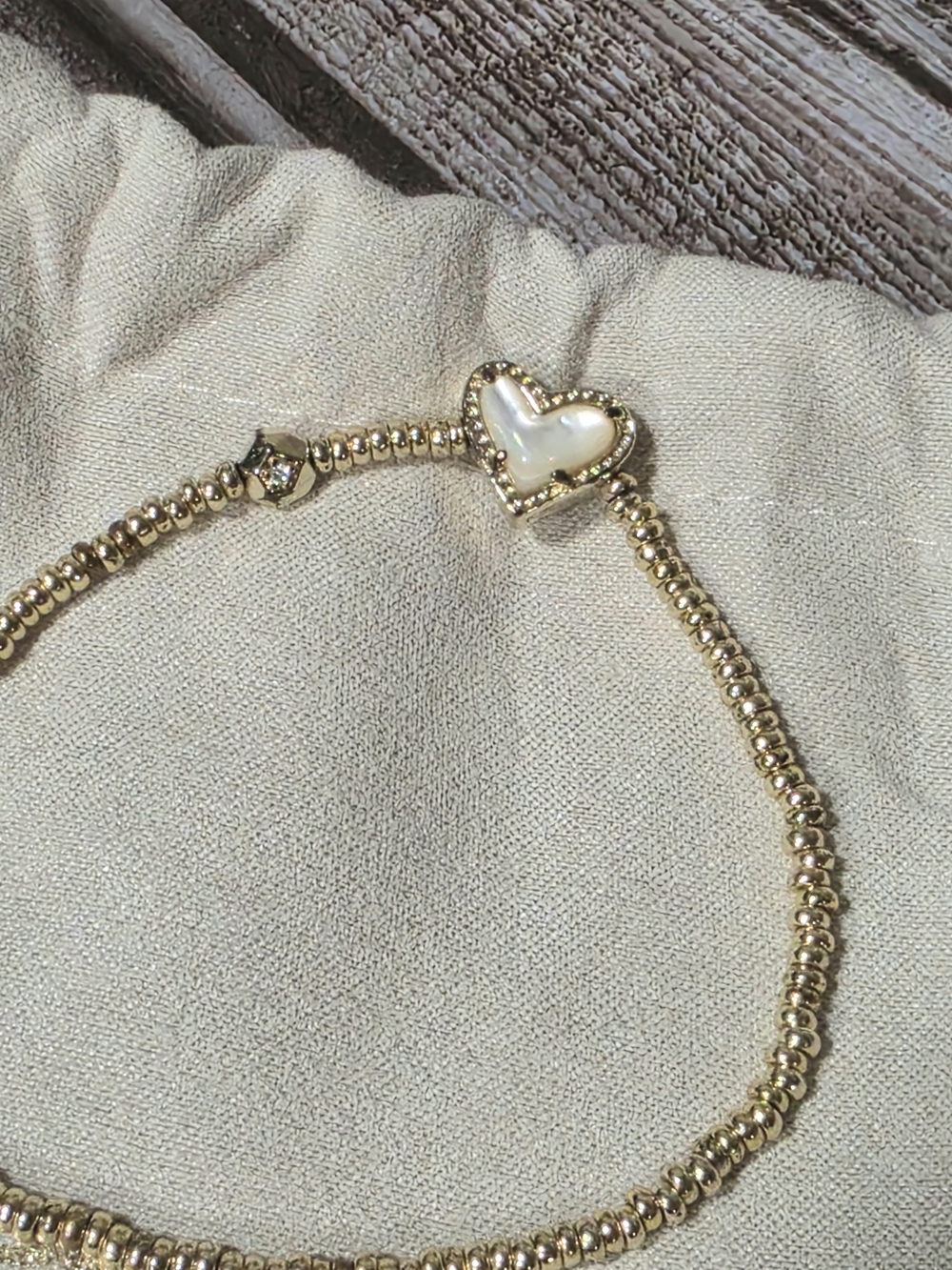 Kendra Scott Gold Ari Stretch Bracelet With Ivory Mother of Pearl Heart Accent - Picture 3 of 7